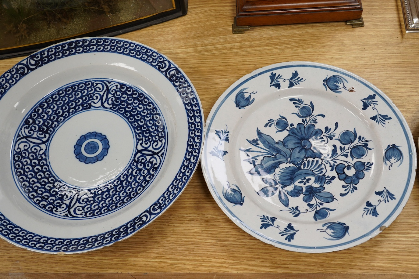 Five various delft dishes, largest 37cm diameter. Condition - poor to fair